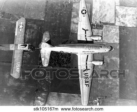 Curtiss C-46E in flight towing a Waco CG-15A glider. View Large Photo Image Picture - Curtiss C-46E in flight towing a Waco CG-15A glider.. Fotosearch