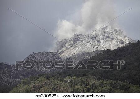 Degassing Rerombola lava dome of Paluweh volcano, Flores, Indonesia. View Large Photo Image Stock Photograph - Degassing Rerombola lava dome of Paluweh volcano, Flores, Indonesia.. Fotosearch