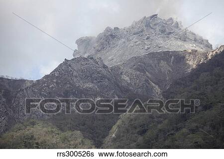 Degassing Rerombola lava dome of Paluweh volcano, Flores, Indonesia. View Large Photo Image Stock Photograph - Degassing Rerombola lava dome of Paluweh volcano, Flores, Indonesia.. Fotosearch