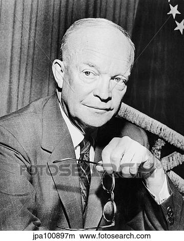 Picture - Digitally restored photo of Dwight Eisenhower holding a pair of glasses.. Fotosearch