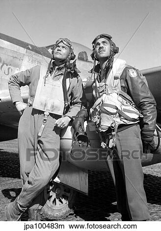 Digitally restored vector photo of Tuskegee Airmen posing with a P-51D aircraft. View Large Photo Image Picture - Digitally restored vector photo of Tuskegee Airmen posing with a P-51D aircraft.. Fotosearch