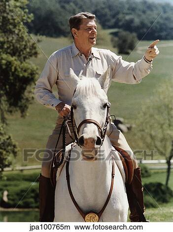 Picture - Digitally restored vector photo of President Ronald Reagan on horseback.. Fotosearch