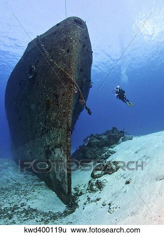 Stock Photograph - Diver exploring the Felipe Xicotencatl shipwreck in Cozumel, Mexico.. Fotosearch