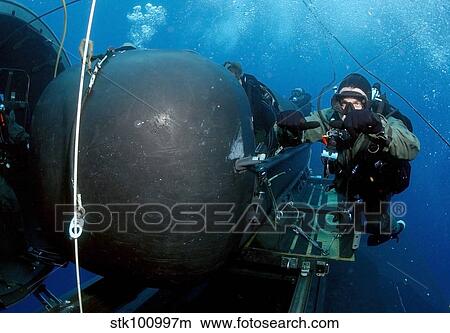 Divers prepare to launch a SEAL Delivery Vehicle. View Large Photo Image Picture - Divers prepare to launch a SEAL Delivery Vehicle.. Fotosearch