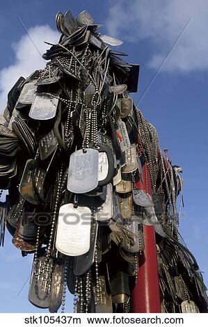 Dog tags from Marines and sailors hang in front of a memorial in Iwo Jima. View Large Photo Image Picture - Dog tags from Marines and sailors hang in front of a memorial in Iwo Jima. . Fotosearch