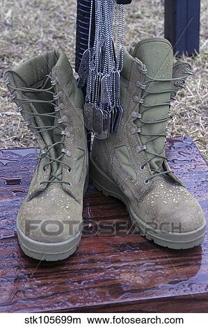 Dog tags hang from a M16 memorial of a fallen soldier. View Large Photo Image Picture - Dog tags hang from a M16 memorial of a fallen soldier.. Fotosearch