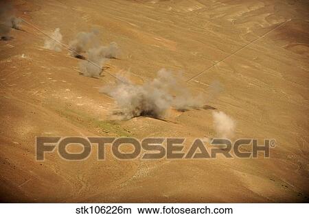 Dust rises from the impact points of KP long-guided rockets. View Large Photo Image Picture - Dust rises from the impact points of KP long-guided rockets.. Fotosearch