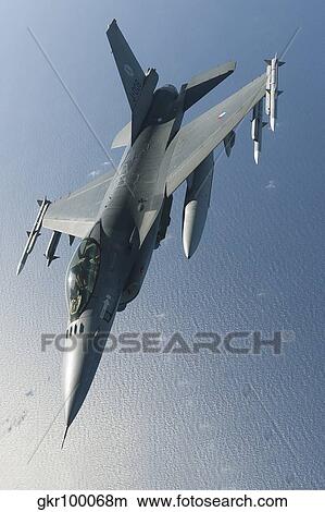 Dutch F-16AM during a combat air patrol sortie over the Mediterranean Sea. View Large Photo Image Picture - Dutch F-16AM during a combat air patrol sortie over the Mediterranean Sea.. Fotosearch