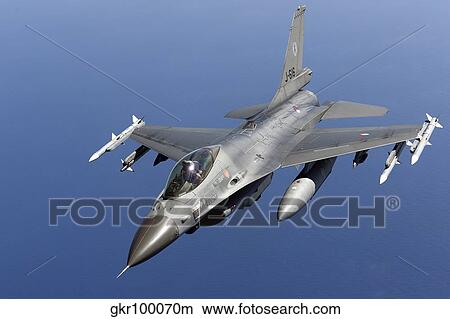 Dutch F-16AM during a combat air patrol sortie over the Mediterranean Sea. View Large Photo Image Picture - Dutch F-16AM during a combat air patrol sortie over the Mediterranean Sea.. Fotosearch