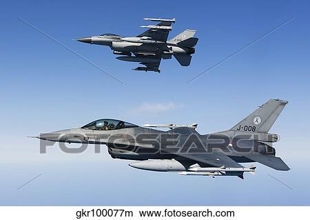 Dutch F-16AMs during a combat air patrol sortie over the Mediterranean Sea. View Large Photo Image Picture - Dutch F-16AMs during a combat air patrol sortie over the Mediterranean Sea.. Fotosearch