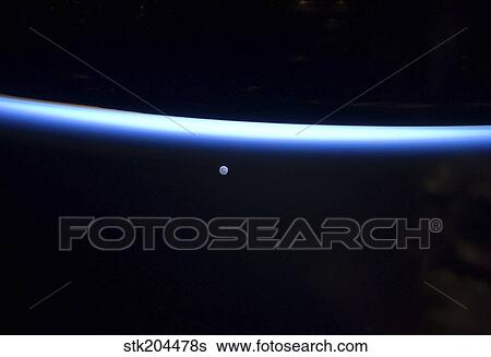 Earth's thin line of atmosphere and a gibbous moon. View Large Photo Image Stock Photograph - Earth's thin line of atmosphere and a gibbous moon.. Fotosearch