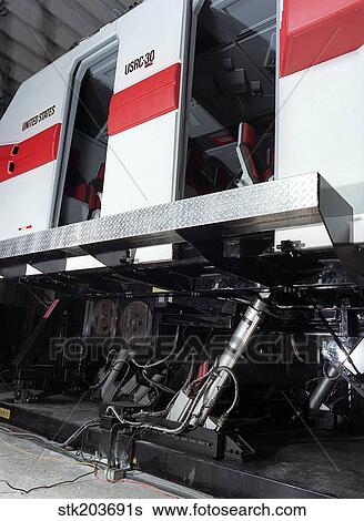 Electric actuators are used on a motion simulator to take passengers on a realistic flight. View Large Photo Image Stock Photograph - Electric actuators are used on a motion simulator to take passengers on a realistic flight.. Fotosearch
