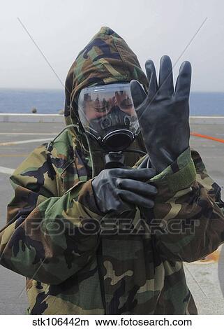 Picture - Ensign dons a lightweight integrated suit technology garment.. Fotosearch