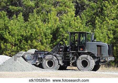Equipment Operator gathers a load of gravel on Camp Johnson. View Large Photo Image Picture - Equipment Operator gathers a load of gravel on Camp Johnson.. Fotosearch