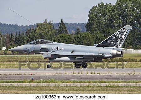 Eurofighter Typhoon of the German Air Force taxiing down the runway. View Large Photo Image Picture - Eurofighter Typhoon of the German Air Force taxiing down the runway.. Fotosearch