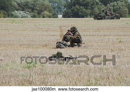 Evacuation of a wounded soldier by an ambulance unit of the Belgian Army. View Large Photo Image Picture - Evacuation of a wounded soldier by an ambulance unit of the Belgian Army.. Fotosearch