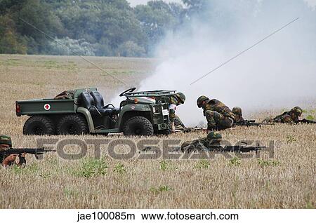 Evacuation of a wounded soldier by an ambulance unit of the Belgian Army. View Large Photo Image Picture - Evacuation of a wounded soldier by an ambulance unit of the Belgian Army.. Fotosearch