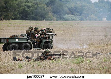 Evacuation of a wounded soldier by an ambulance unit of the Belgian Army. View Large Photo Image Picture - Evacuation of a wounded soldier by an ambulance unit of the Belgian Army.. Fotosearch