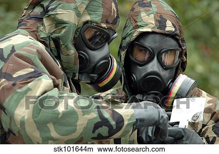 Explosive Ordnance Technicians run tests on substances. View Large Photo Image Picture - Explosive Ordnance Technicians run tests on substances.. Fotosearch