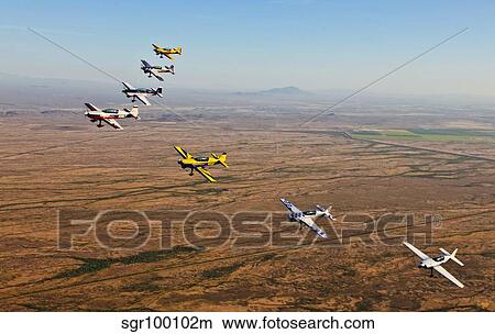 Extra 300 aerobatic aircraft fly in formation over Mesa, Arizona. View Large Photo Image Picture - Extra 300 aerobatic aircraft fly in formation over Mesa, Arizona.. Fotosearch