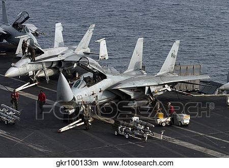 F-14D Tomcats on the flight deck of USS Theodore Roosevelt. View Large Photo Image Picture - F-14D Tomcats on the flight deck of USS Theodore Roosevelt.. Fotosearch