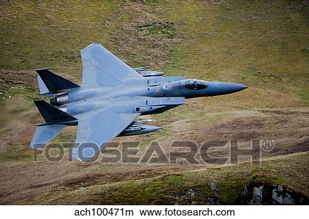 F-15E Strike Eagle low flying over North Wales. View Large Photo Image Picture - F-15E Strike Eagle low flying over North Wales.. Fotosearch