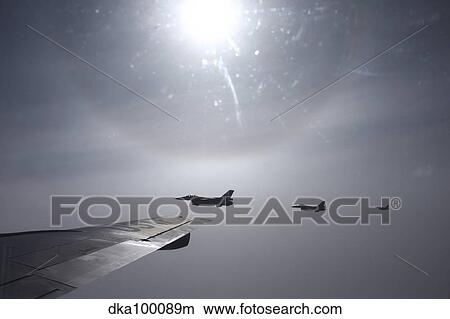 F-16 Fighting Falcon fighters over the wing of a KC-135 Stratotanker. View Large Photo Image Picture - F-16 Fighting Falcon fighters over the wing of a KC-135 Stratotanker.. Fotosearch