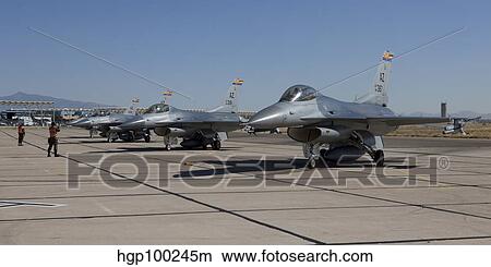F-16's line up at the end of the runway for preflight checks. View Large Photo Image Picture - F-16's line up at the end of the runway for preflight checks.. Fotosearch