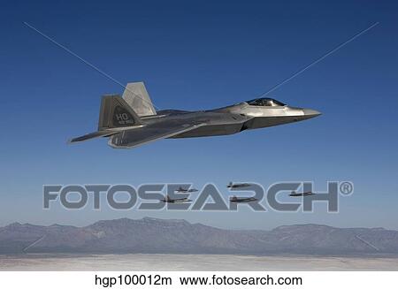 F-22 Raptors fly in formation during a training mission over New Mexico. View Large Photo Image Picture - F-22 Raptors fly in formation during a training mission over New Mexico.. Fotosearch