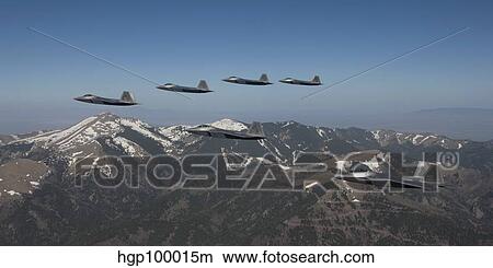 F-22 Raptors fly in formation during a training mission over New Mexico. View Large Photo Image Picture - F-22 Raptors fly in formation during a training mission over New Mexico.. Fotosearch