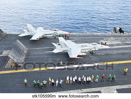 Picture - F/A-18 aircraft prepare to take off from the flight deck of USS Enterprise.. Fotosearch
