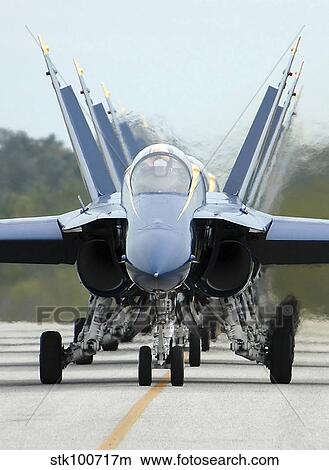 F/A-18A Hornets assigned to the Blue Angels, taxi back to their flight line. View Large Photo Image Picture - F/A-18A Hornets assigned to the Blue Angels, taxi back to their flight line.. Fotosearch