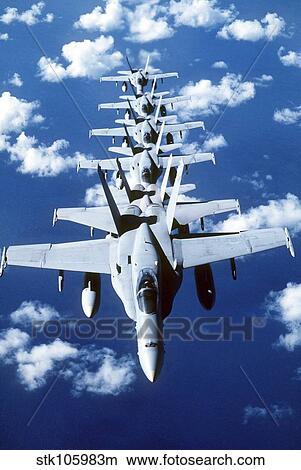 F/A-18C Hornet aircraft fly in formation during Operation Desert Shield. View Large Photo Image Picture - F/A-18C Hornet aircraft fly in formation during Operation Desert Shield.. Fotosearch