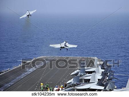F/A-18F Super Hornets launch from the aircraft carrier USS Enterprise. View Large Photo Image Picture - F/A-18F Super Hornets launch from the aircraft carrier USS Enterprise.. Fotosearch
