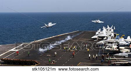 Picture - F/A-18F Super Hornets launch simultaneously from the aircraft carrier USS John C. Stennis.. Fotosearch
