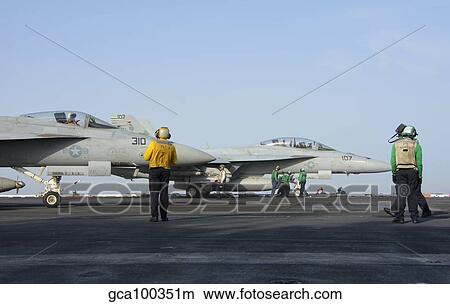 F/A-18F Super Hornets on the flight deck of USS Theodore Roosevelt. View Large Photo Image Picture - F/A-18F Super Hornets on the flight deck of USS Theodore Roosevelt.. Fotosearch