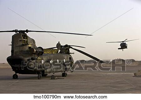Field maintenance on a CH-47 Chinook, Tikrit, Iraq. View Large Photo Image Picture - Field maintenance on a CH-47 Chinook, Tikrit, Iraq.. Fotosearch