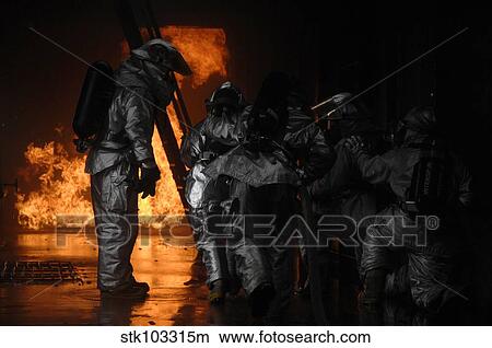 Picture - Firefighters extinguish a simulated cargo fire at RAF Mildenhall, England.. Fotosearch