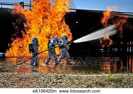 Firefighters work to extinguish a simulated engine fire at Cannon Air Force Base. View Large Photo Image Picture - Firefighters work to extinguish a simulated engine fire at Cannon Air Force Base.. Fotosearch