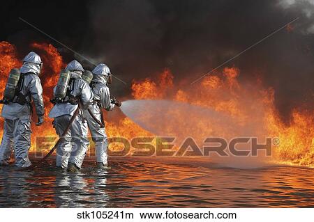 Firefighting Marines battle a huge blaze. View Large Photo Image Picture - Firefighting Marines battle a huge blaze.. Fotosearch