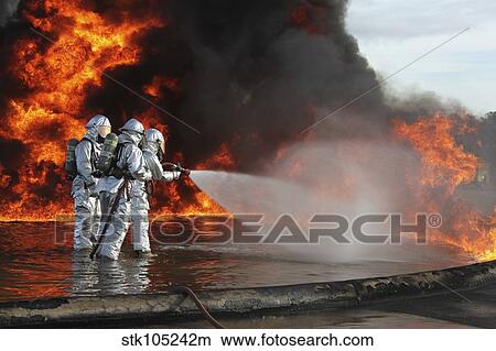 Firefighting Marines battle a huge blaze. View Large Photo Image Picture - Firefighting Marines battle a huge blaze.. Fotosearch