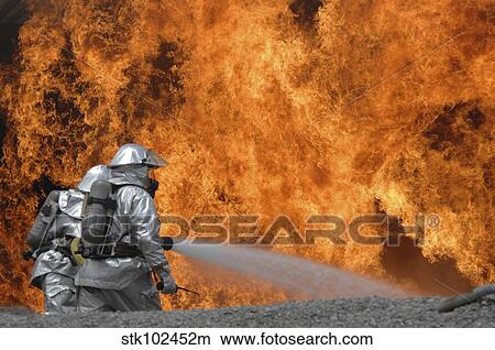 Picture - Firemen neutralize a fire.. Fotosearch