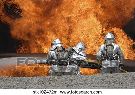 Picture - Firemen neutralize a fire. Fotosearch
