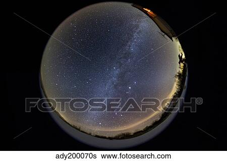 Stock Photograph - Fish-eye lens view of the northern winter sky.. Fotosearch