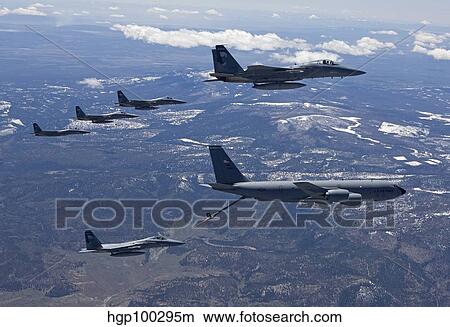 Five F-15 Eagles conduct aerial refueling with a KC-135 Stratotanker. View Large Photo Image Picture - Five F-15 Eagles conduct aerial refueling with a KC-135 Stratotanker.. Fotosearch
