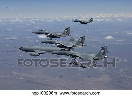 Five F-15 Eagles conduct aerial refueling with a KC-135 Stratotanker. View Large Photo Image Picture - Five F-15 Eagles conduct aerial refueling with a KC-135 Stratotanker.. Fotosearch
