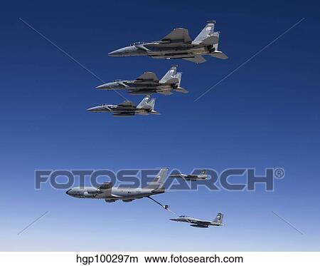 Five F-15 Eagles conduct aerial refueling with a KC-135 Stratotanker. View Large Photo Image Picture - Five F-15 Eagles conduct aerial refueling with a KC-135 Stratotanker.. Fotosearch