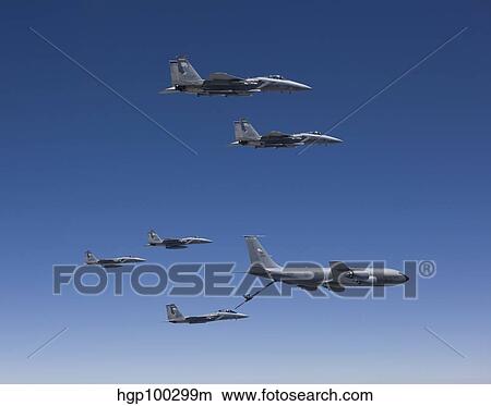 Five F-15 Eagles conduct aerial refueling with a KC-135 Stratotanker. View Large Photo Image Picture - Five F-15 Eagles conduct aerial refueling with a KC-135 Stratotanker.. Fotosearch