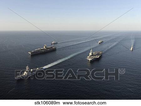 Fleet of Navy ships transit the Arabian Sea. View Large Photo Image Picture - Fleet of Navy ships transit the Arabian Sea.. Fotosearch