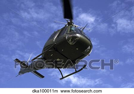 Former U. S. Air Force Bell UH-1E Huey helicopter in flight. View Large Photo Image Picture - Former U. S. Air Force Bell UH-1E Huey helicopter in flight.. Fotosearch